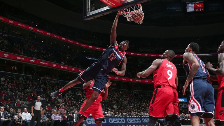 WASHINGTON, DC -..JANUARY 13: Thomas Bryant #13 of the Washington Wizards dunks the ball against the Toronto Raptors on January 13, 2019 at Capital One Arena in Washington, DC. NOTE TO USER: User expressly acknowledges and agrees that, by downloading and/or using this photograph, user is consenting to the terms and conditions of the Getty Images License Agreement. Mandatory Copyright Notice: Copyright 2019 NBAE (Photo by Ned Dishman/NBAE via Getty Images).