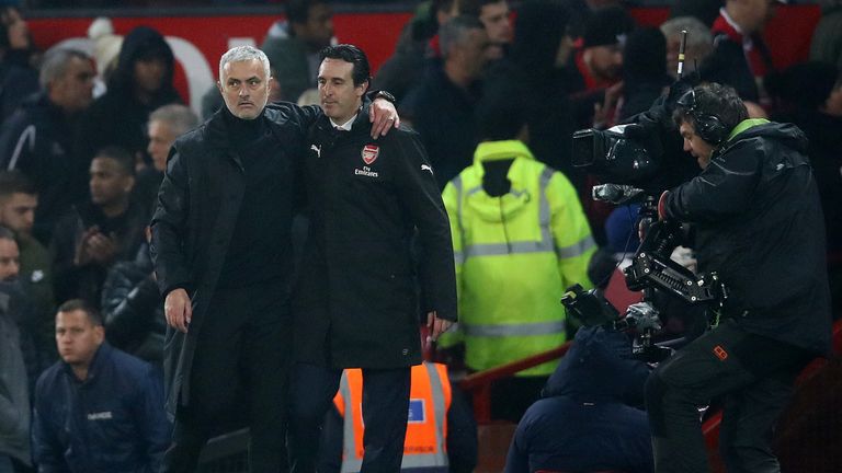 Jose Mourinho, Manager of Manchester United and Unai Emery, Manager of Arsenal hug each other after the Premier League match between Manchester United and Arsenal FC at Old Trafford on December 5, 2018 in Manchester, United Kingdom.