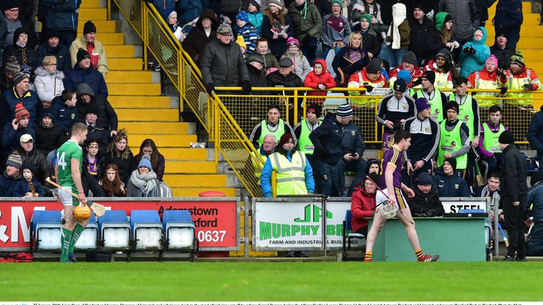 Marching orders: Seamus Flanagan and Liam Ryan make their way off the field after receiving red cards
