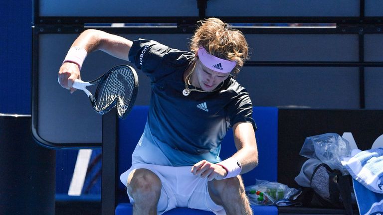 Alexander Zverev smashes his racket during his match  against Milos Raonic 