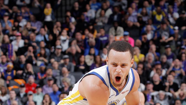 Stephen Curry celebrates after making a three-pointer