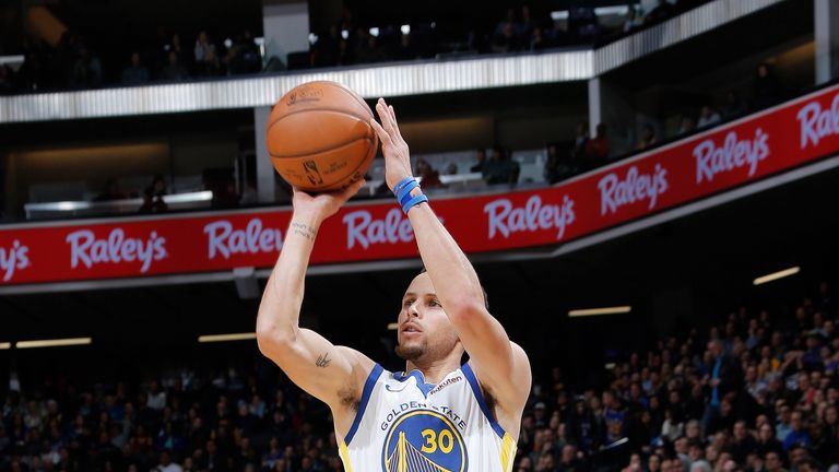 Stephen Curry fires a three-pointer