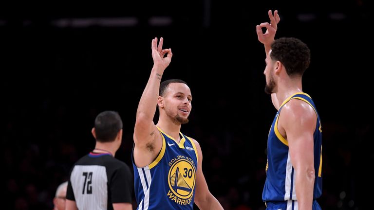 Stephen Curry and Klay Thompson celebrate a basket against the Los Angeles Lakers