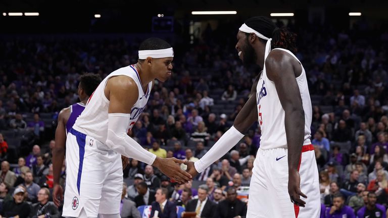 Tobias Harris and Montrezl Harrell celebrate a bucket for the Clippers