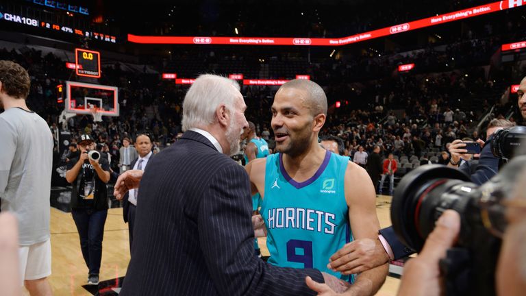 Tony Parker embracing Spurs coach Gregg Popovich on his San Antonio return with Charlotte