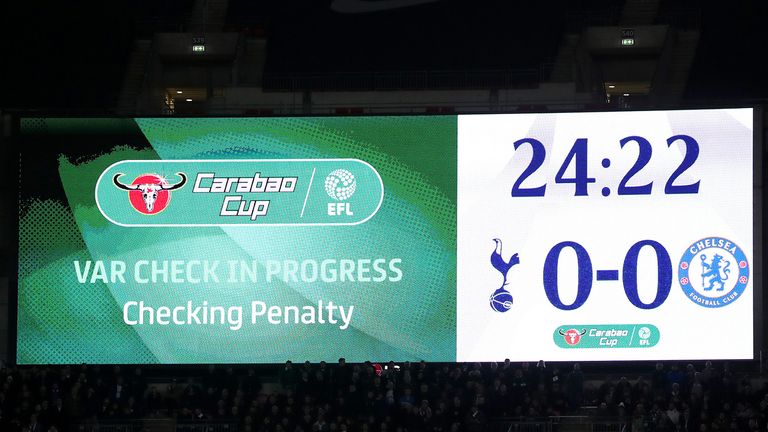 The LED screen displays a message stating that VAR Checking is in process during the Carabao Cup Semi-Final First Leg match between Tottenham Hotspur and Chelsea at Wembley Stadium on January 8, 2019 in London, England.