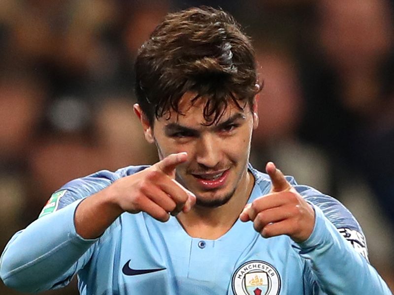 Brahim poses in the Real Madrid jersey