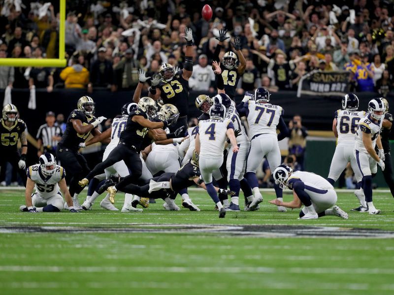 Los Angeles Rams kicker Greg Zuerlein holds the NFC trophy in the locker  room after overtime of the NFL football NFC championship game against the  New Orleans Saints, Sunday, Jan. 20, 2019