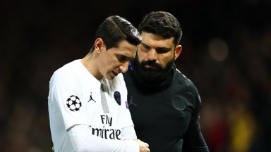 Image of Angel Di Maria receives medical attention after being shoved off the pitch  