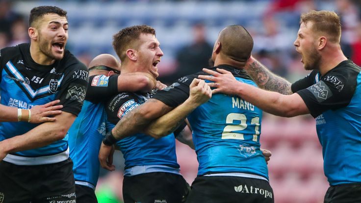 Picture by Alex Whitehead/SWpix.com - 24/02/2019 - Rugby League - Betfred Super League - Wigan Warriors v Hull FC - DW Stadium, Wigan, England - Hull FC's Marc Sneyd (centre) celebrates with team-mates after kicking a drop goal in extra time to win the game.