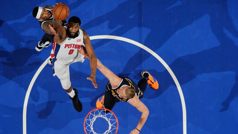 Andre Drummond claims a rebound against Denver