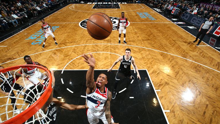Bradley Beal shoots close to the basket against Brooklyn