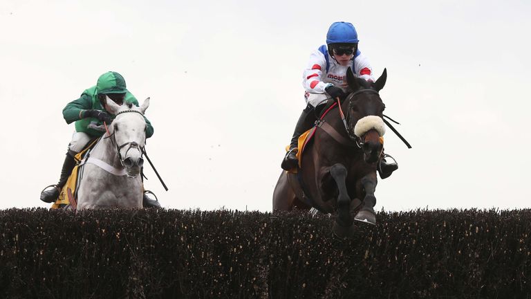 Clan Des Obeaux and Harry Cobden (right) lead Terrefort at Ascot