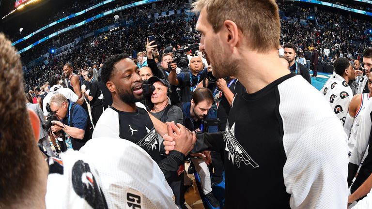 Dwyane Wade and Dirk Nowitzki congratulate one another at the All-Star Game