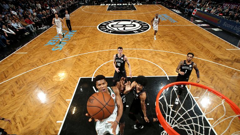 Giannis Antetokounmpo scores with a lay-up against Brooklyn