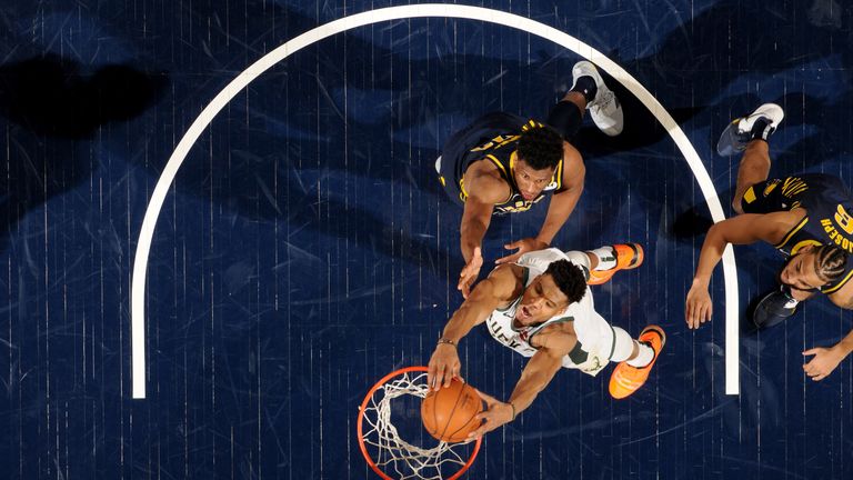 Giannis Antetokounmpo slams home a dunk on the way to a triple-double against the Indiana Pacers