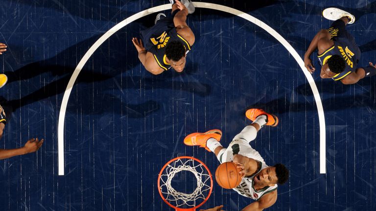 Giannis Antetokounmpo rams home a dunk on his way to a triple-double against the Indiana Pacers