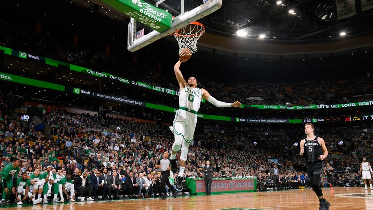 Jayson Tatum dunks against the Detroit Pistons