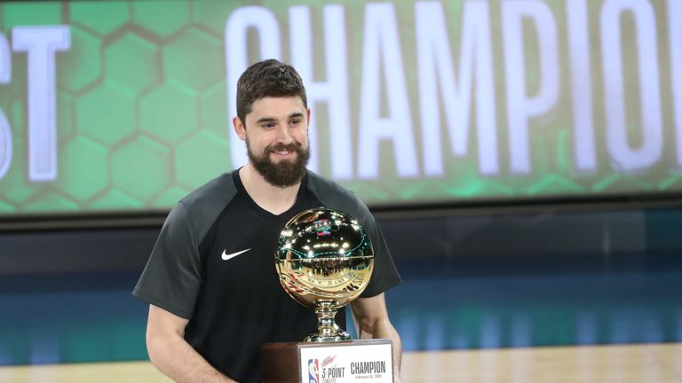 Joe Harris poses with the trophy after winning the Three-Point Contest
