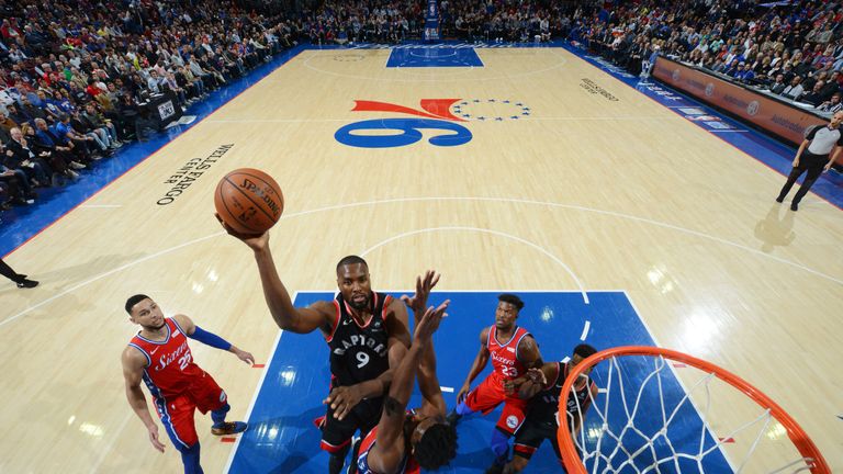 Kawhi Leonard lofts a floater in the lane against Philadelphia