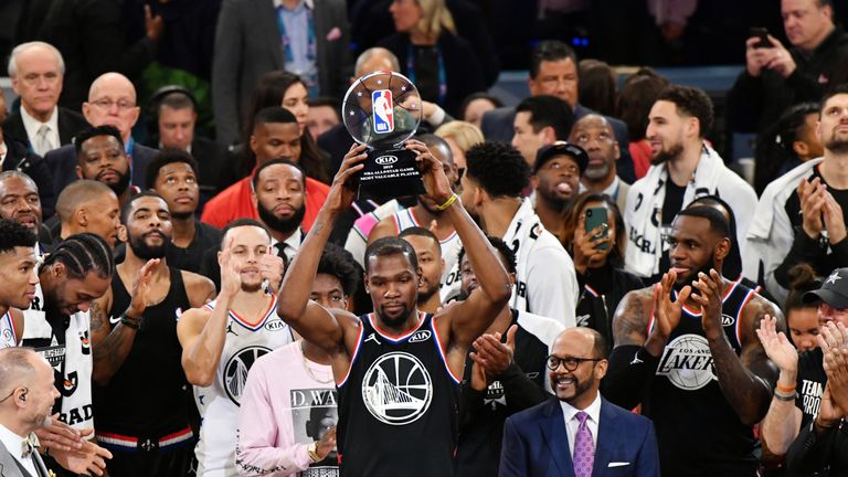 Kevin Durant lifts the All-Star Game MVP trophy