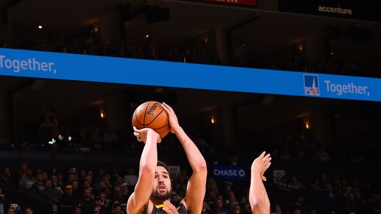 Klay Thompson fires a fadeaway jump shot against San Antonio