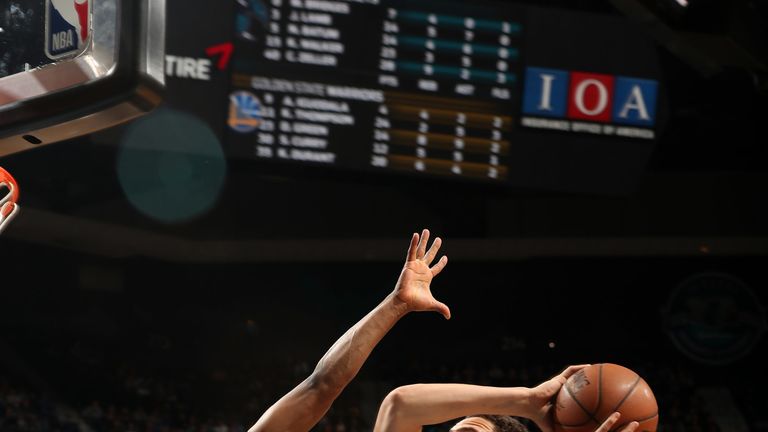 Klay Thompson lofts a jump shot against Charlotte