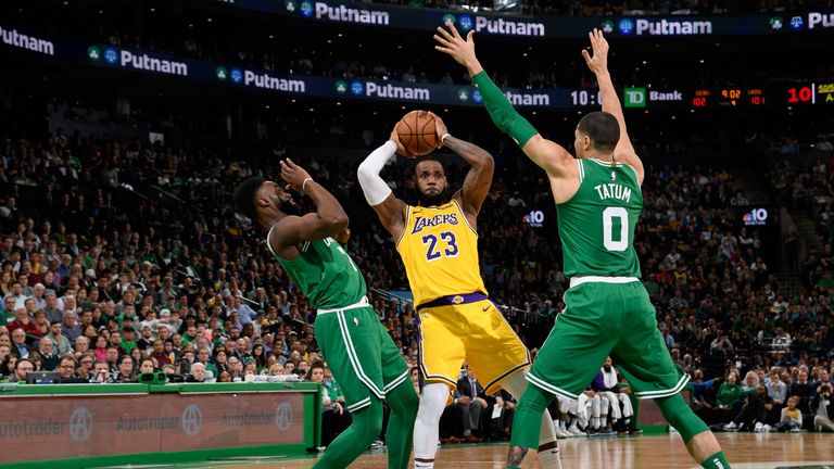 LeBron James passes out of a Celtics double team