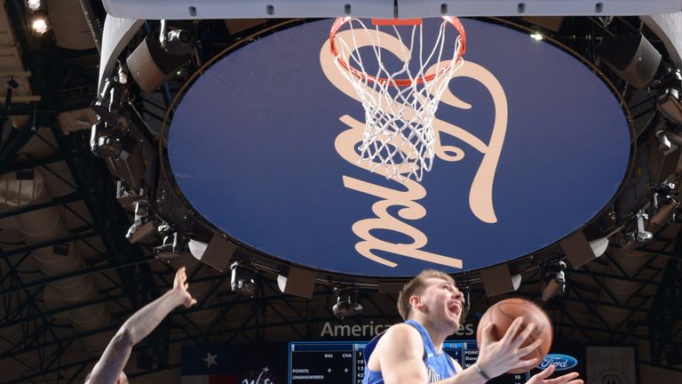 Luka Doncic makes an acrobatic plays at the basket