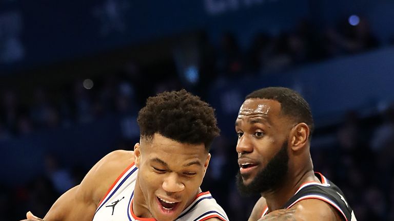 Giannis Antetokounmpo  tries to dribble past LeBron James during the 2019 All-Star Game