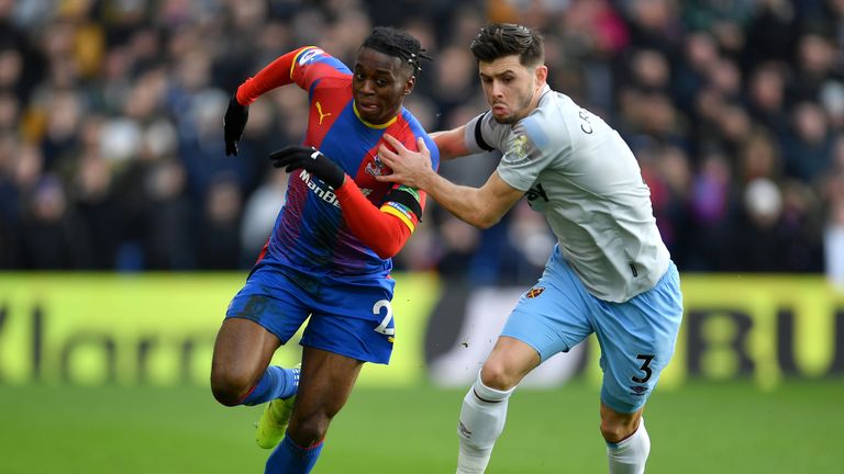 Aaron Wan-Bissaka battles for possession with Aaron Cresswell