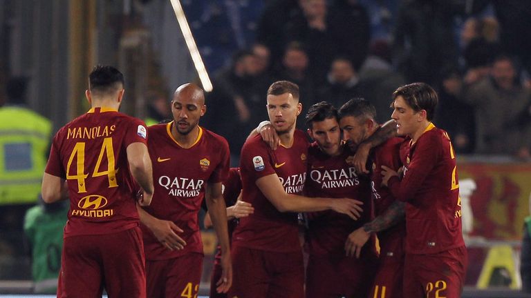 ROME, ITALY - FEBRUARY 18:  Aleksandar Kolarov #11 with his teammates of AS Roma celebrates after scoring the opening goal from penalty spot during the Serie A match between AS Roma and Bologna FC at Stadio Olimpico on February 18, 2019 in Rome, Italy.  (Photo by Paolo Bruno/Getty Images)