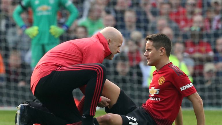 Ander Herrera receives treatment on the pitch after picking up an injury