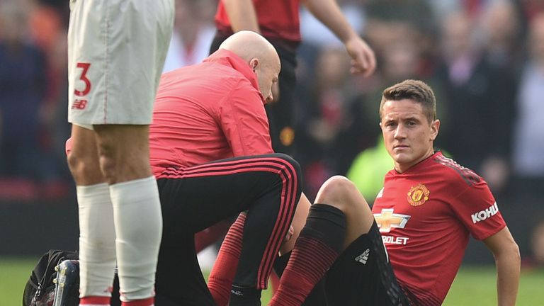 Ander Herrera receives treatment on the pitch after picking up an injury