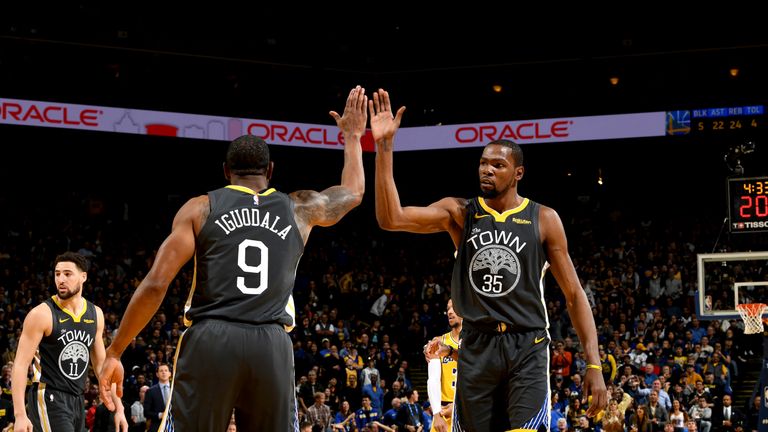 Kevin Durant #35 of the Golden State Warriors hi-fives Andre Iguodala #9 of the Golden State Warriors during the game against the Los Angeles Lakers on February 2, 2019 at ORACLE Arena in Oakland, California.