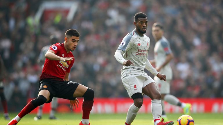 Andreas Pereira and Gini Wijnaldum during the Premier League match between Manchester United and Liverpool FC at Old Trafford on February 24, 2019 in Manchester, United Kingdom.