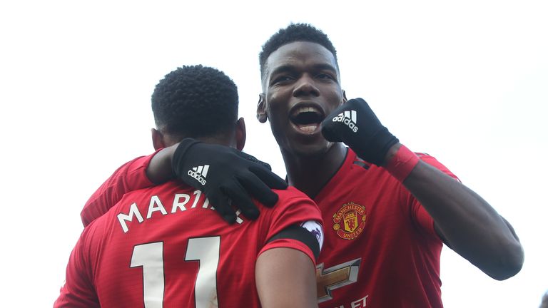 Anthony Martial celebrates with Paul Pogba after scoring their second goal