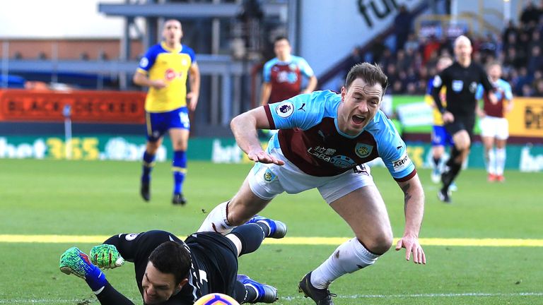 Ashley Barnes goes down after a challenge by Alex McCarthy 