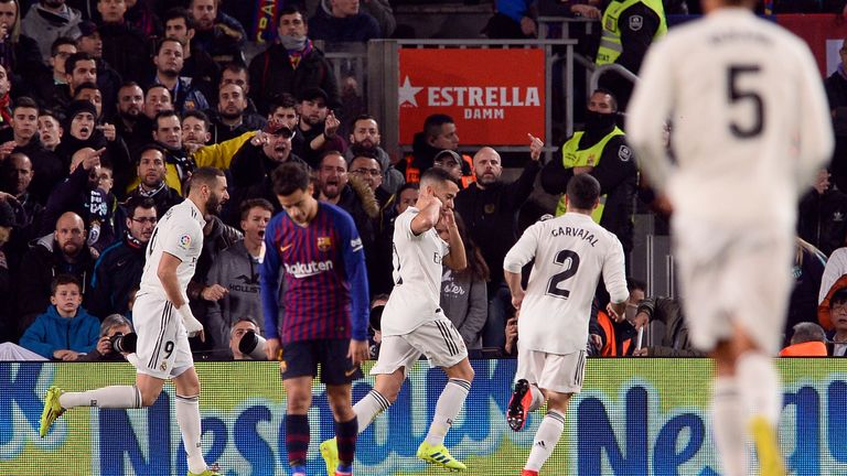 Real Madrid's Spanish midfielder Lucas Vazquez (C) celebrates scoring the opening goal during the Spanish Copa del Rey (King's Cup) semi-final first leg football match between FC Barcelona and Real Madrid CF at the Camp Nou stadium in Barcelona