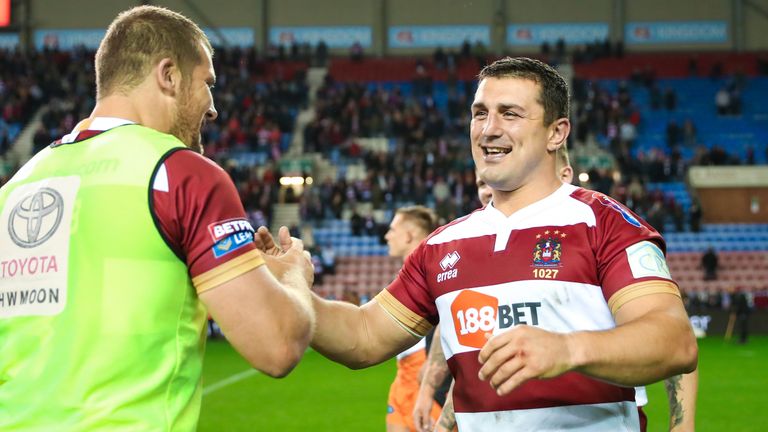 Wigan's Ben Flower (R) celebrating their Grand Final win at Old Trafford 