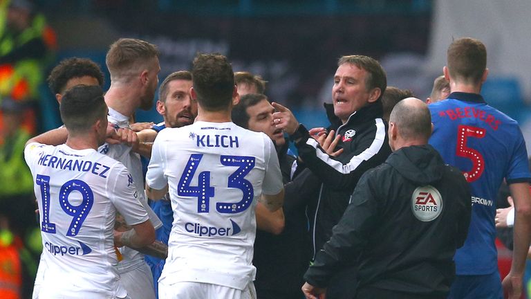 Bolton Wanderers manager Phil Parkinson argues with Leeds United players before being sent off