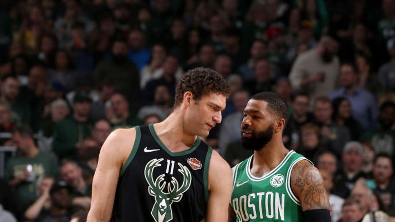 Brook Lopez of the Milwaukee Bucks and Marcus Morris of the Boston Celtics share a moment