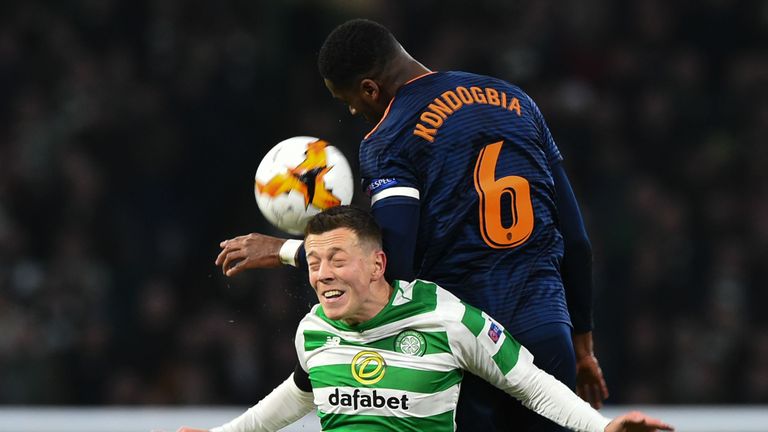 Valencia midfielder Geoffrey Kondogbia (R) out-jumps Celtic's Scottish midfielder Callum McGregor