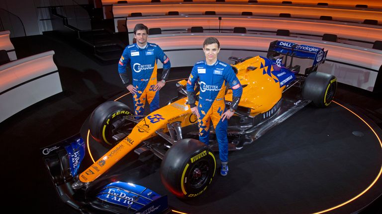 Carlos Sainz and Lando Norris alongside the new McLaren MCL34