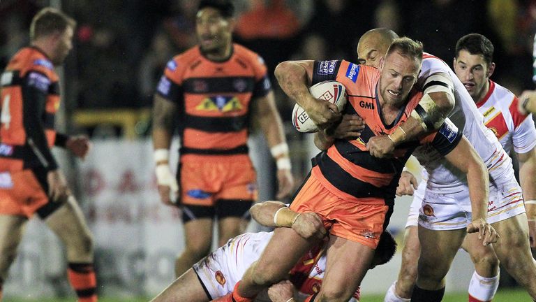 Castleford's Liam Watts is tackled by Catalans Dragons' Mikael Simon and Sam Moa