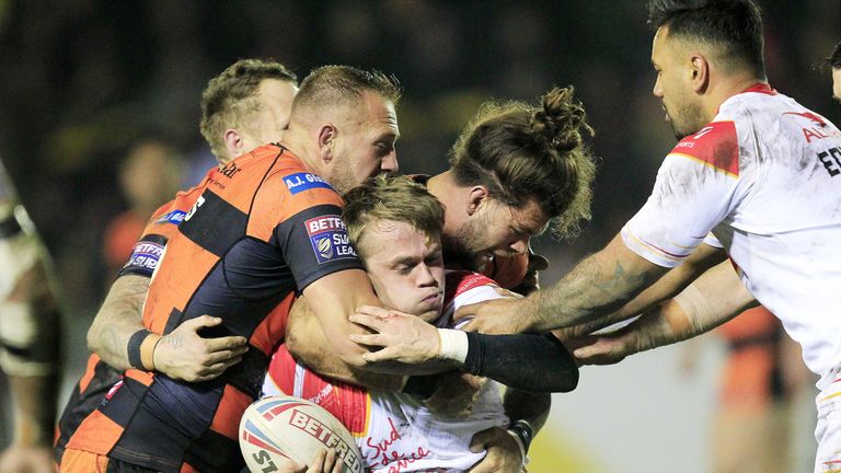 Mike McMeeken, Grant Millington and Alex Foster tackle Catalans' Lewis Tierney