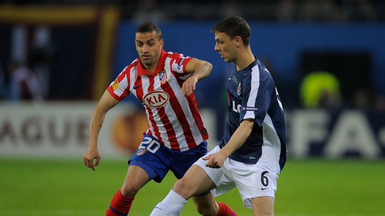 Simao of Atletico Madrid and Chris Baird of Fulham battle for the ball during the UEFA Europa League final match between Atletico Madrid and Fulham at HSH Nordbank Arena on May 12, 2010 in Hamburg, Germany. 