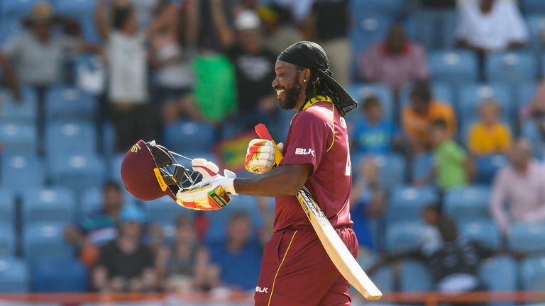 Chris Gayle celebrates reaching his century in the fourth ODI against England