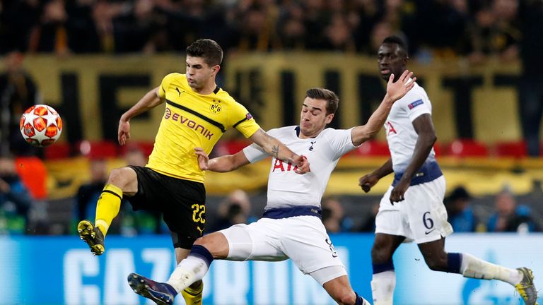 Christian Pulisic competes with Harry Winks during the UEFA Champions League round of 16, first leg at Wembley Stadium