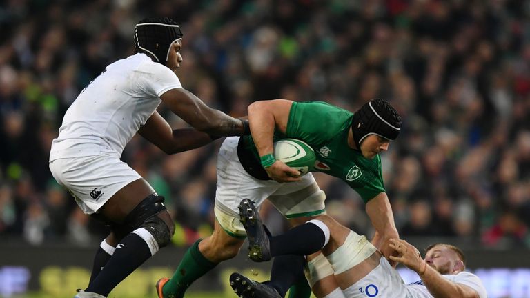 CJ Stander is tackled by Maro Itoje and George Kruis 